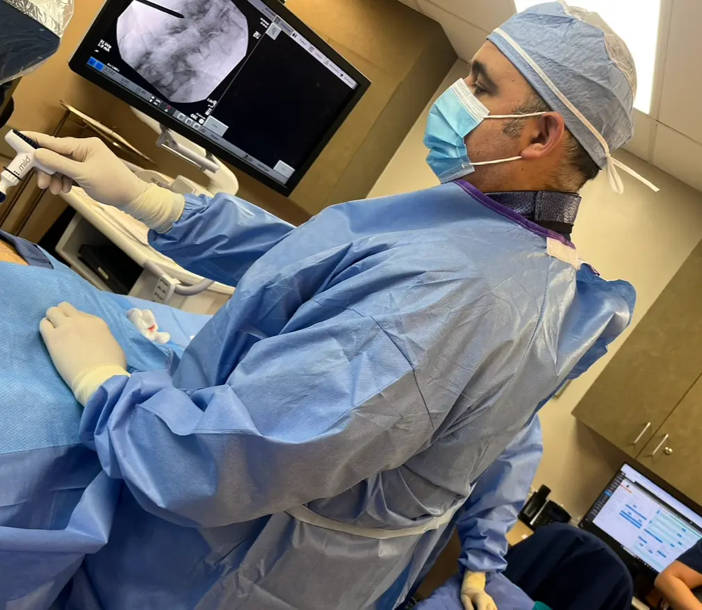 Dr. Edward S. Rubin MD performing an interventional pain procedure in the operating room