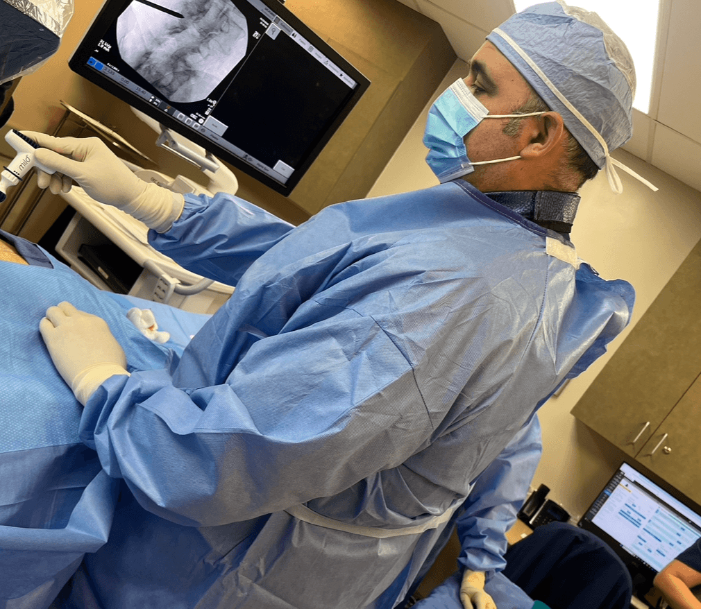 Dr. Edward S. Rubin MD performing an interventional pain procedure in the operating room